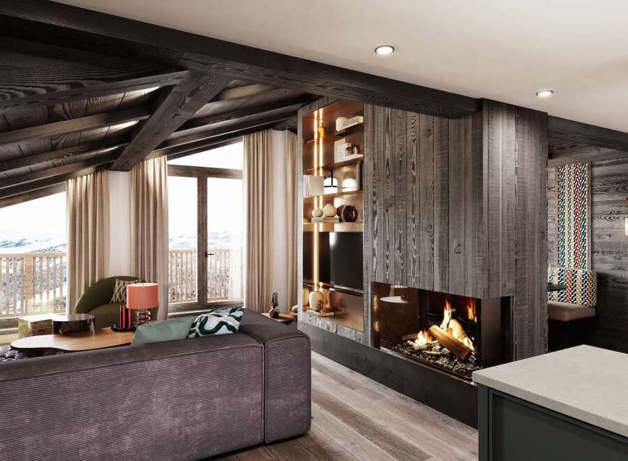This stunning chalet boasts a spacious open-plan living area with a cozy fireplace, perfect for relaxing after a day on the slopes.