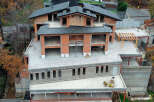 Luxury chalet under construction in the mountains, offering stunning views.