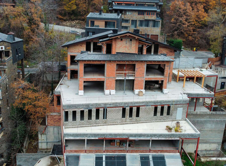 This stunning property boasts a unique architectural design, blending modern and traditional elements.
