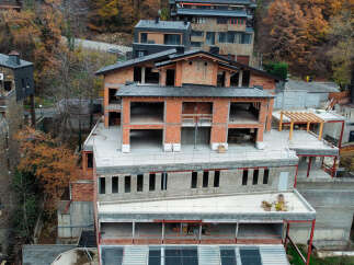 This stunning property boasts a unique architectural design, blending modern and traditional elements.