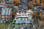 Luxury homes nestled in the mountains with stunning autumn foliage views.