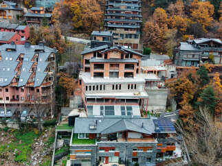 Luxury homes nestled in the mountains with stunning autumn foliage views.