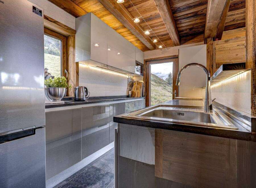 Experience rustic charm and modern convenience in this stunning kitchen.