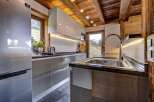 Experience rustic charm and modern convenience in this stunning kitchen.