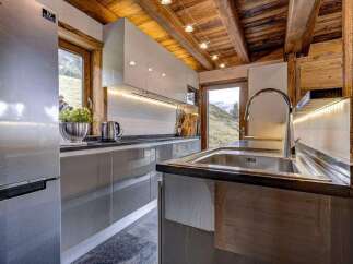 Experience rustic charm and modern convenience in this stunning kitchen.