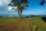 Lakefront property with private dock and expansive lawn.