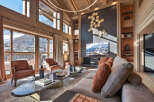 Experience luxury living in this stunning property, featuring expansive windows that frame breathtaking mountain views.