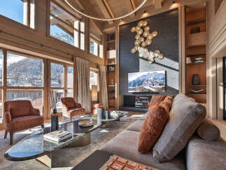 Experience luxury living in this stunning property, featuring expansive windows that frame breathtaking mountain views.