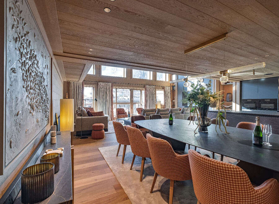 Experience luxury living in this stunning property, featuring a spacious dining area perfect for entertaining.