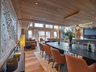 Experience luxury living in this stunning property, featuring a spacious dining area perfect for entertaining.