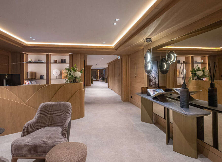 Step into luxury with this stunning property, showcasing exquisite wooden paneling and a welcoming reception area.