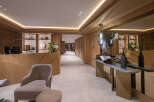 Step into luxury with this stunning property, showcasing exquisite wooden paneling and a welcoming reception area.