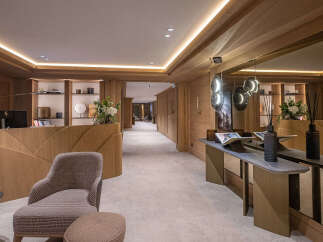 Step into luxury with this stunning property, showcasing exquisite wooden paneling and a welcoming reception area.