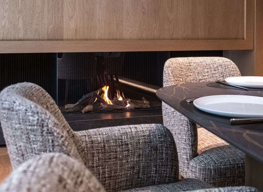 Experience luxury living with this stunning property featuring a cozy fireplace, perfect for creating a warm and inviting atmosphere.