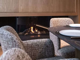 Experience luxury living with this stunning property featuring a cozy fireplace, perfect for creating a warm and inviting atmosphere.