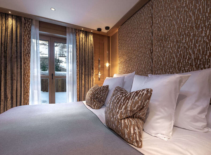 Experience luxury and tranquility in this exquisite bedroom.