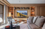 Experience luxury living in this stunning property, featuring a beautifully designed living room with a modern entertainment center.
