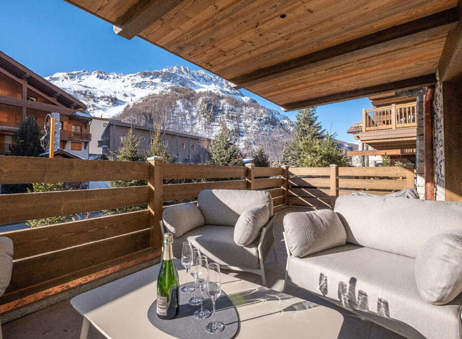 Enjoy breathtaking mountain views from this luxurious balcony.