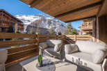 Enjoy breathtaking mountain views from this luxurious balcony.