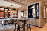 Experience luxury living in this stunning property, featuring exquisite wooden accents and a modern design.