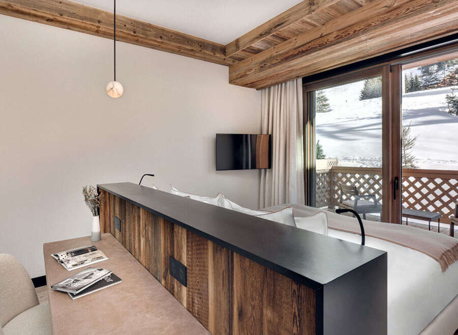 Experience luxury living in this stunning property, featuring a beautifully designed bedroom with a modern aesthetic.