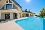 Experience luxury living in this stunning modern villa, featuring a spacious open-plan design and a breathtaking infinity pool.