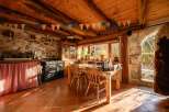 Rustic charm meets modern convenience in this unique stone and wood home.