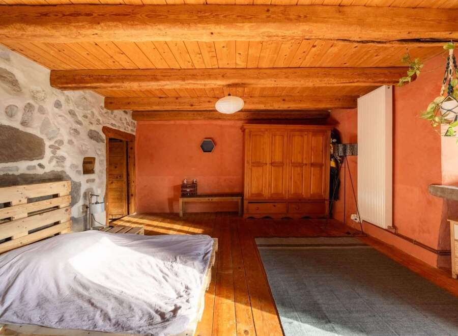 Rustic charm meets modern comfort in this unique bedroom.