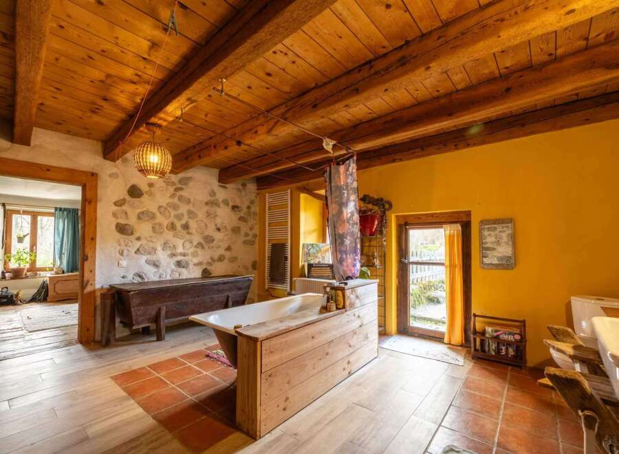 Rustic charm meets modern comfort in this unique bathroom.