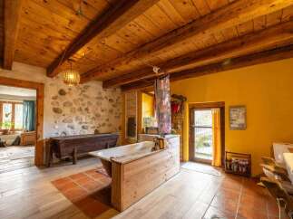 Rustic charm meets modern comfort in this unique bathroom.