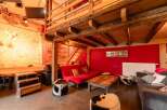 Rustic-chic barn conversion with exposed beams and a mezzanine level.