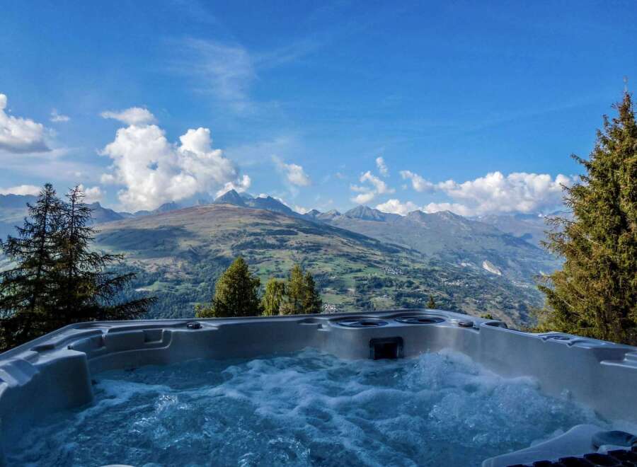 Luxury mountaintop hot tub with breathtaking panoramic views.
