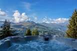 Luxury mountaintop hot tub with breathtaking panoramic views.