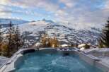 Luxury chalet with breathtaking mountain views and a private hot tub.