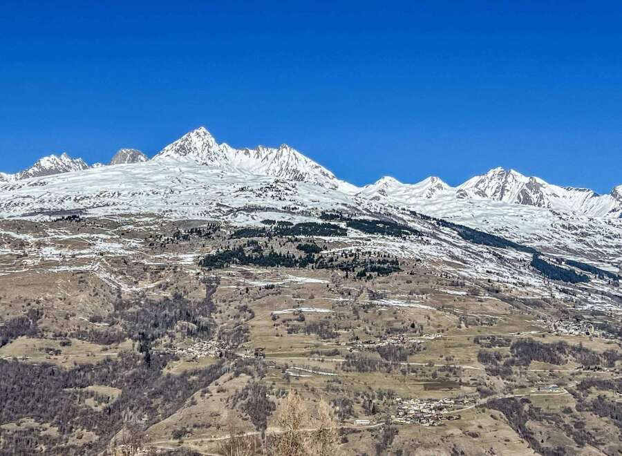 Breathtaking mountain views and a charming village nestled in the valley below.
