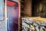 Luxurious chalet sauna with stunning wood and stone finishes.