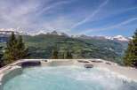 Luxury chalet with breathtaking mountain views and a private hot tub.