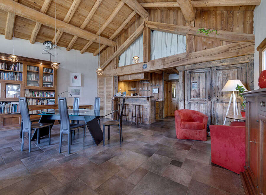 Experience rustic elegance in this stunning property, featuring exposed wooden beams and a cozy ambiance.