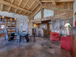 Experience rustic elegance in this stunning property, featuring exposed wooden beams and a cozy ambiance.