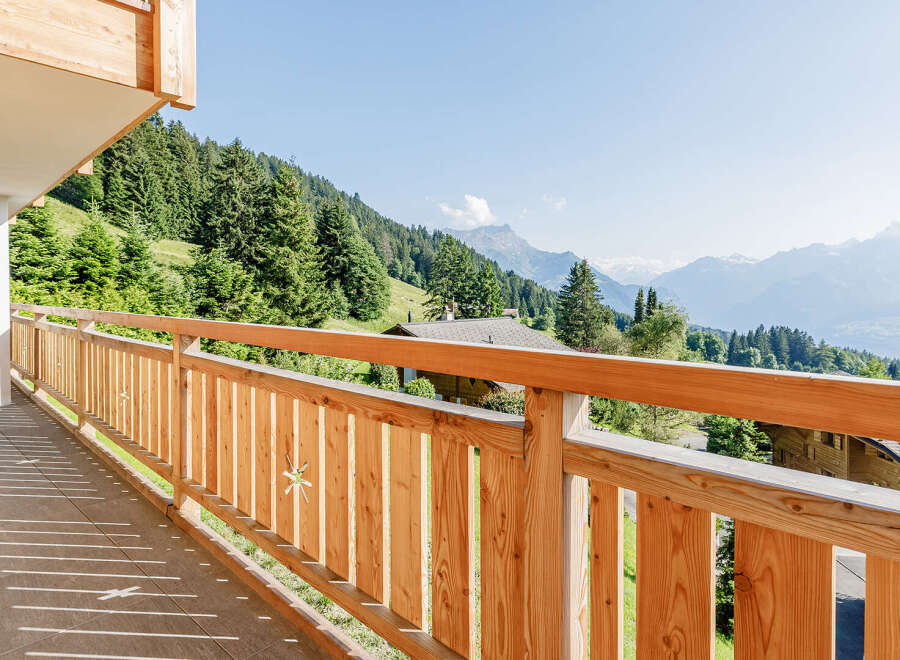 Enjoy breathtaking mountain views from this stunning balcony.