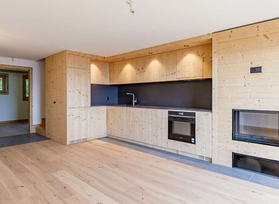 Discover the charm of this beautifully designed property, featuring a modern kitchen with sleek cabinetry and appliances.