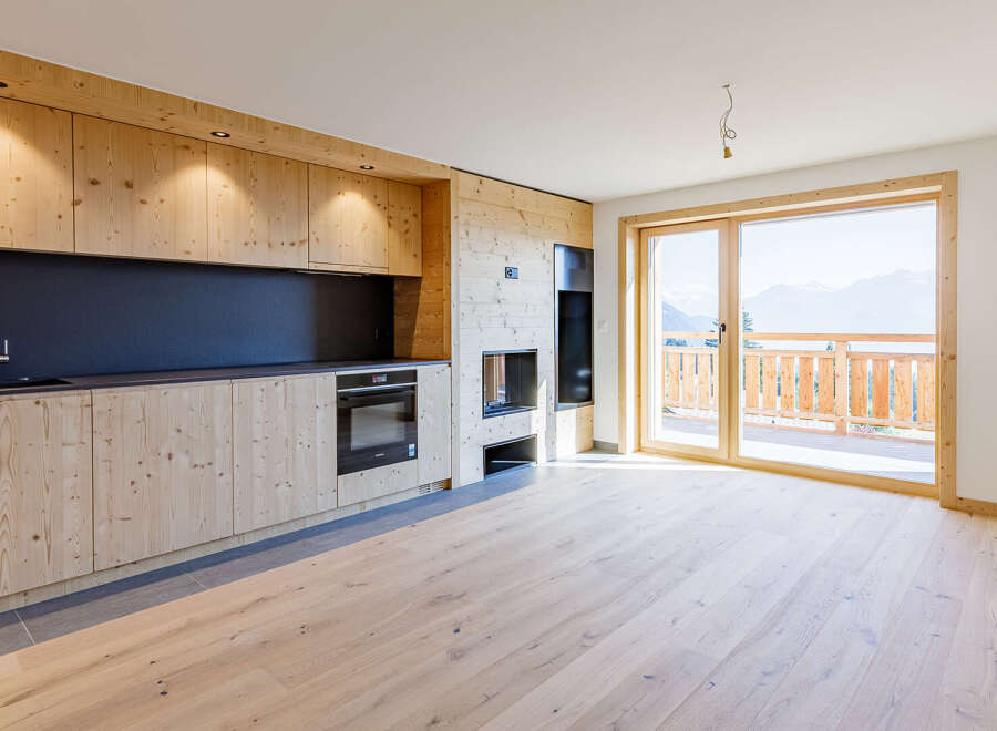 Experience the warmth of this stunning property with its inviting wooden interior.