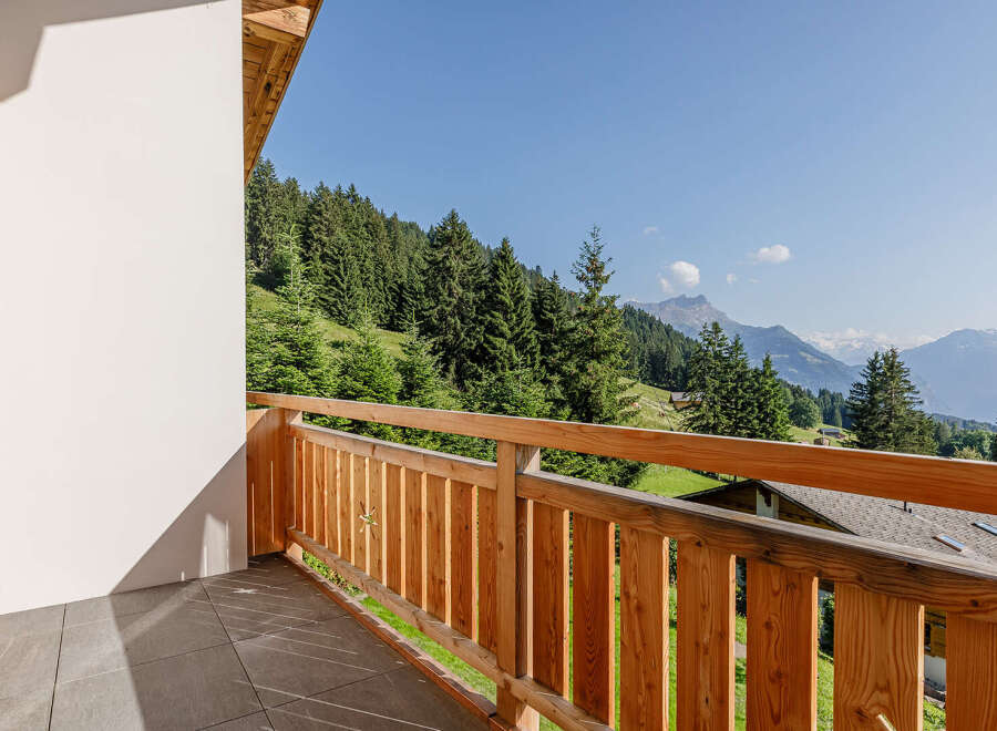 Enjoy breathtaking mountain views from this stunning balcony.