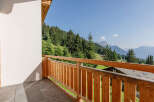 Enjoy breathtaking mountain views from this stunning balcony.