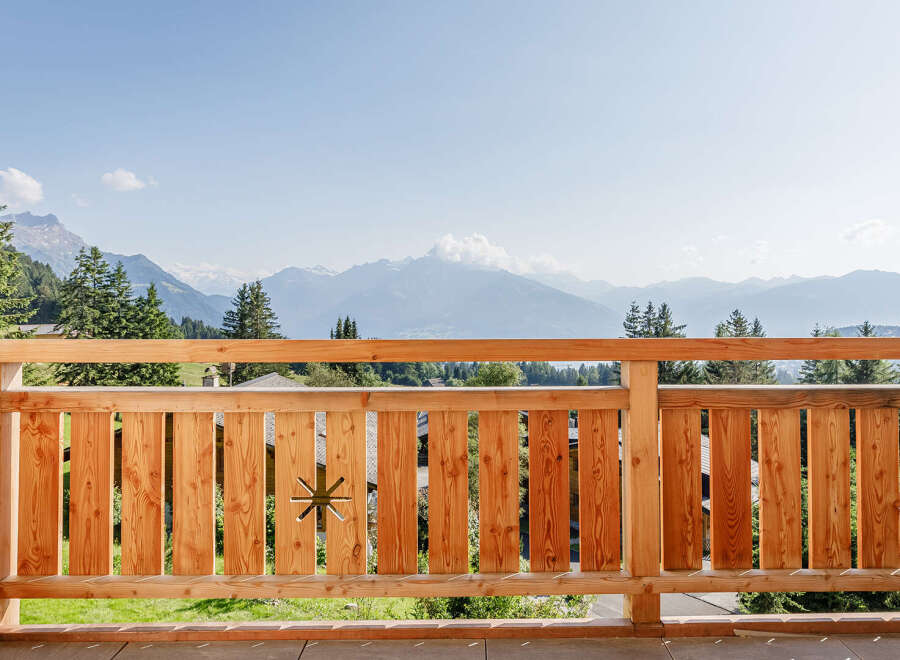 Enjoy breathtaking mountain views from this stunning balcony.