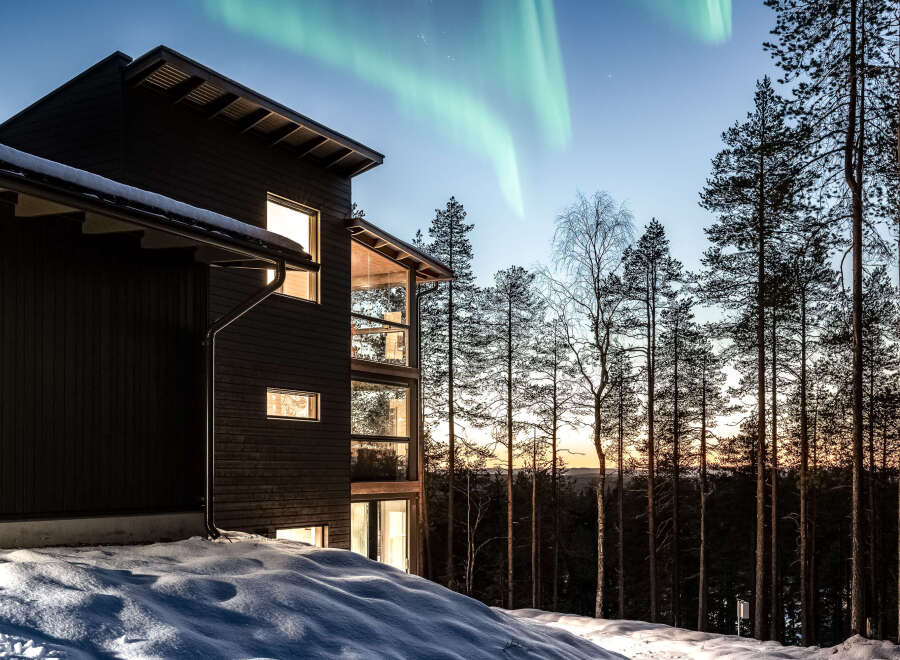 Experience the magic of the Northern Lights from this stunning modern home.