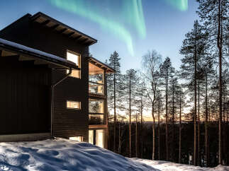 Experience the magic of the Northern Lights from this stunning modern home.