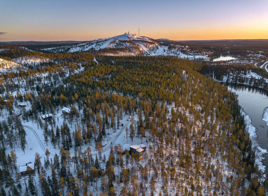 Experience the serene beauty of this winter wonderland, featuring a stunning aerial view of a snow-covered landscape.