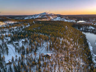 Experience the serene beauty of this winter wonderland, featuring a stunning aerial view of a snow-covered landscape.