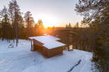 Experience the tranquility of this stunning modern home nestled in a snowy landscape.